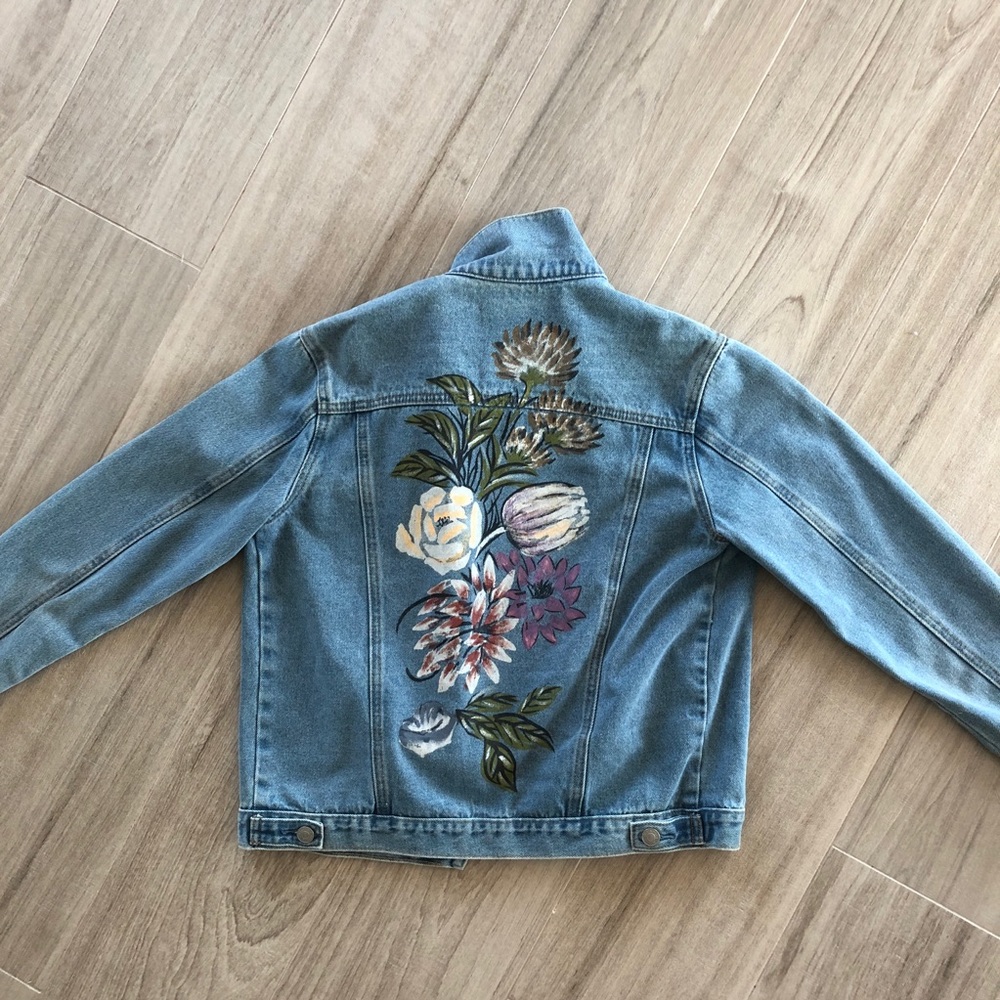 Denim jacket with painted flowers on back